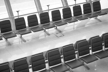airport waiting room black and white photo