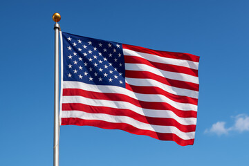 Obraz premium United States Flag: The American flag waves proudly in a bright blue sky, symbolizing freedom, unity, and the values of the United States of America. Capturing national pride and patriotism.