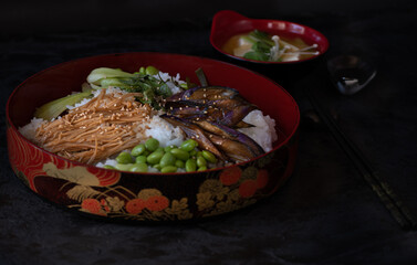 Chirashizushi and miso served in traditional Japanese dishes