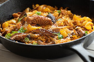 Cabbage, shiitake mushroom and pepper stewed with Asian sauce in cast iron pan