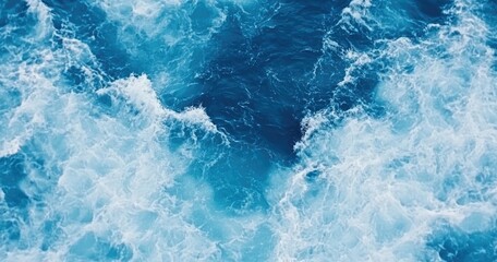 Fototapeta premium Powerful ocean waves, vibrant blues and whites. A breathtaking view from above, displaying the energy and beauty of the sea