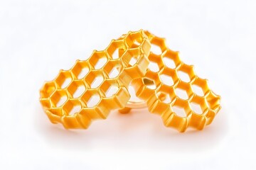 Two gold, honeycomb-shaped objects, overlapping, isolated on white