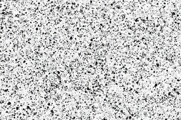 Abstract textured surface with scattered dark specks
