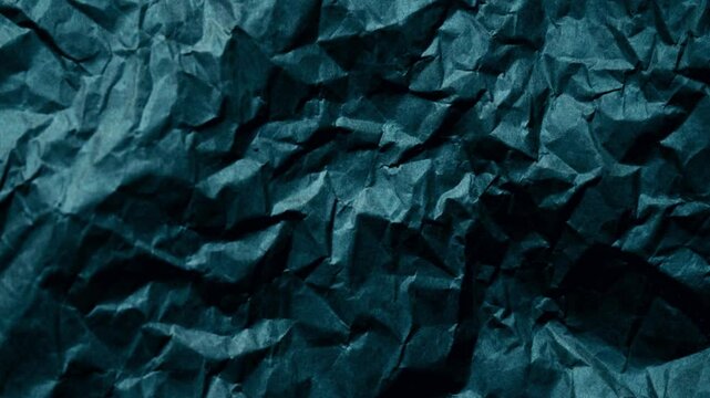 Animated blue crumpled paper, looped animation. 
