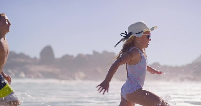 People, children and smile at beach with running for fun, bonding and support in Bali. Siblings, kids and happy or excited with playing ocean on summer holiday, adventure and break to relax and love
