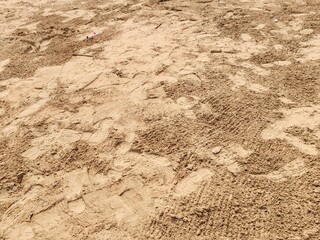 Soil or Mud! Brown ground surface, Close up natural background. Soil wall texture of clay house structure. Fine beach sand, Soil wall of clay house structure, mud background. Vintage tone.