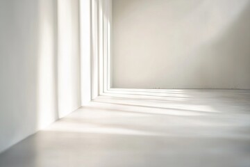 Empty, bright, minimalist room with sunbeams