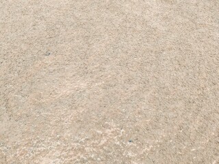 Soil or Mud! Brown ground surface, Close up natural background. Soil wall texture of clay house structure. Fine beach sand, Soil wall of clay house structure, mud background. Vintage tone.