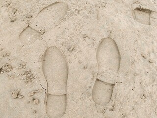 Footstep on sandy Beach, Foot print on Soil. Footprints in the sand on the beach. Top view. Sand in...