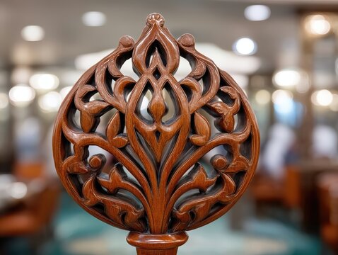 Intricate wooden Quran stand illuminated by soft light showcasing masterful craftsmanship and design