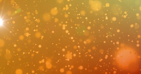 Image of light and orange spots on orange background