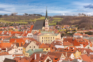 Aerial view of rooftops and church tower in Cesky Krumlov, Czech Republic