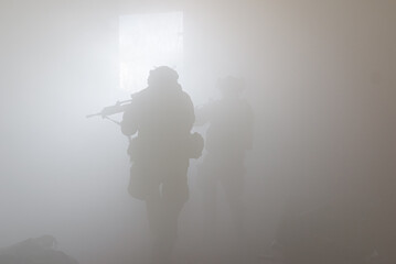 silhouette of a soldier in the smoke