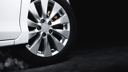 Luxury Metallic Car Wheel, Close-up of a alloy wheel with tire of car on black background.