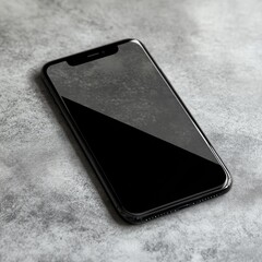 Modern smartphone on a textured surface.  A sleek, black device rests on a mottled gray surface. The screen is dark and blank