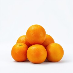 Pile of fresh oranges stacked high isolated on white background