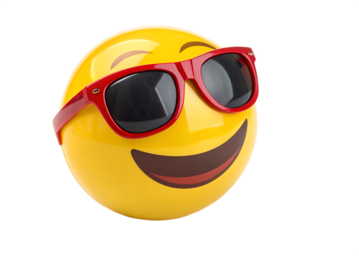 A yellow emoji face with red sunglasses smiling on a black background in a studio shot image