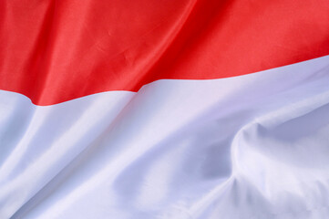 Close-up of the national flag of Indonesia fluttering in the wind, wave pattern
