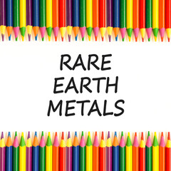 Rare earth metals symbol. Concept words Rare earth metals on beautiful white paper. Beautiful white paper background. Colored pencils. Business and rare earth metals concept. Copy space.