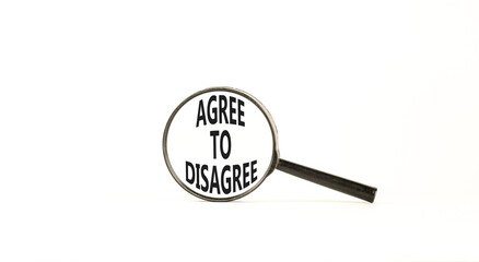 Agree to disagree symbol. Concept words Agree to disagree on beautiful white paper in magnifying glass. Beautiful white background. Business and agree to disagree concept. Copy space