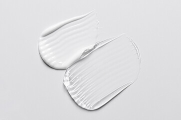 A sample of white and transparent cosmetic cream