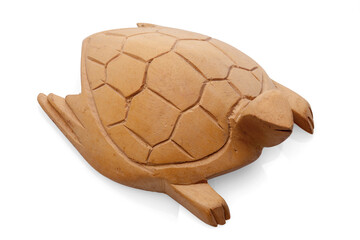 small light brown wooden turtle with carvings on the carapace on a white background