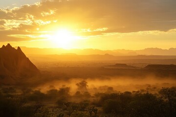 Obraz premium Sunrise over desert with red rock formations and giraffes