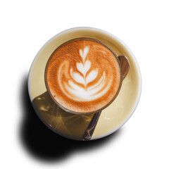 Top view of Cafe latte coffee with latte art in yellow ceramic saucer plate and spoon isolated cutout in transparent background.