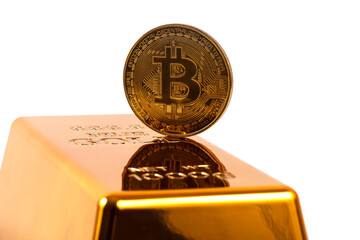 Gold coin with cryptocurrency symbol Bitcoin and gold bar on white background