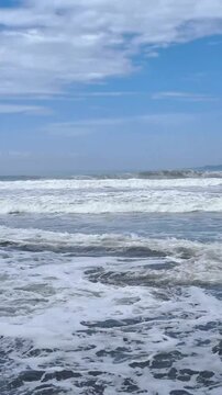 Dangerous wave current and overlap,rip current.Ocean wave rolling create crushing wave breaking,current flow toward the shore and collide with flowsback.Strong countercurrent wave with foam and splash