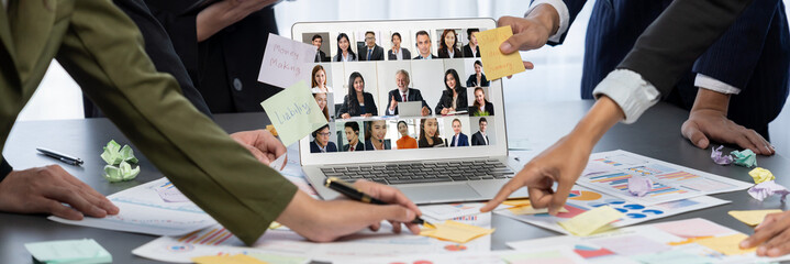 Analyst team use sticky note for creative and analytic brainstorm for business idea with BI data dashboard on laptop screen. Analysis financial data visualization tech for marketing strategy. Prodigy