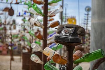  Vintage Telephone Displayed on Artistic Glass Bottle Sculpture