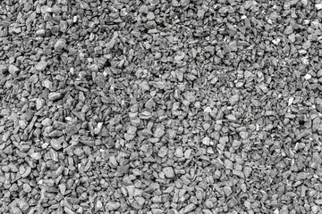Close-up of grey gravel stones in a uniform texture