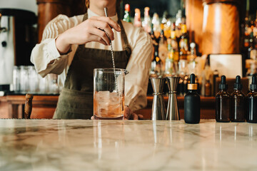 Bartender Stirring Cocktail with Mixing Spoon