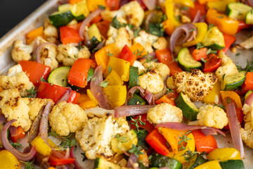 Close up of Roasted Vegetable Salad with Fresh Herbs and Sprouts