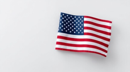 Fototapeta premium image of single folded american flag in center on plain white background for memorial day