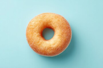minimalistic top down image of single donut perfectly centered on clean solid color background offering generous 70