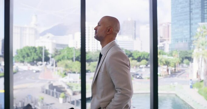 Office building, serious and businessman walking by window for corporate, career or work in morning. Company, attorney and travel with bag in law firm lobby for professional, appointment and job