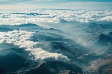 Fototapeta premium Aerial view of Andes mountains with clouds and valleys