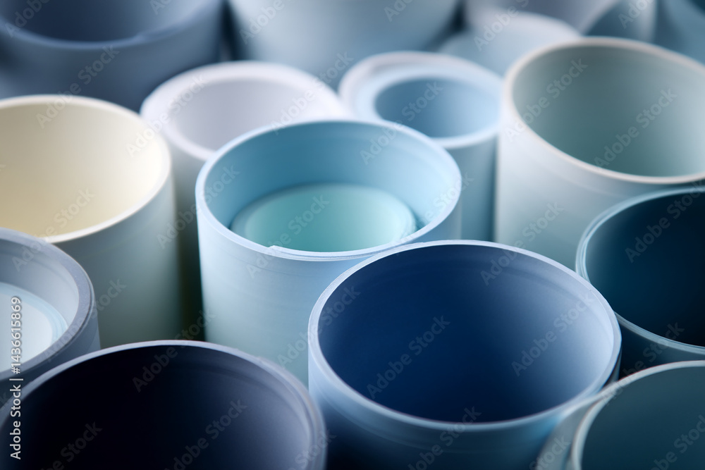 Leinwandbilder Close-up of rolled paper tubes in varying shades of blue, creating a textured background ideal for design projects, showcasing a smooth and subtle color gradient