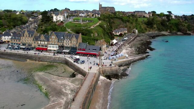 France travel, most scenic traditional villages in Brittany - beautiful Cancale, famous for oysters and turquoise sea. High angle drone 4k hd video
