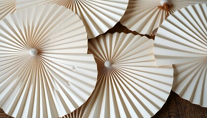 group of paper umbrellas sitting on top of a wooden table
