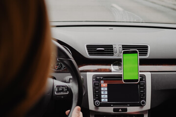 Man drive the car and using mobile app , green screen