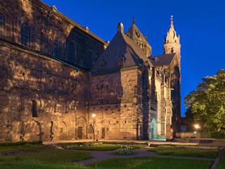 Worms, Germany. Fragment of St. Peter's Cathedral (Worms Cathedral) in dusk. View from south-west on chapel of St. Nicholas and relicts of the cloister. The cathedral was built from about 1130 to 1181