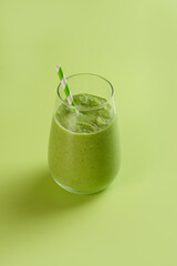 A Refreshing Green Smoothie Served Chilled in a Glass Accompanied