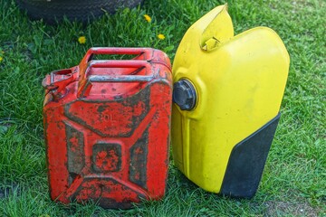 one iron dirty yellow with black round cap closed industrial fuel empty old motorcycle tank stands...