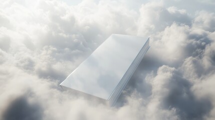 A blank book floating among shimmering silver clouds and mist in a dreamlike scene