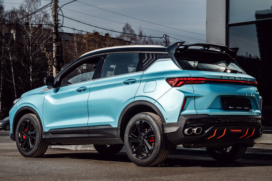 Russia, Ryazan - April 17, 2025: Geely showroom. Photo of the rear end of a Geely Coolray, a blue car, parked in a parking lot.