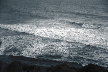 A raging ocean. Waves on the horizon. The appearance of foam. A refreshing landscape. Open space. Wide angle shooting. High angle