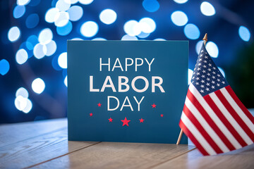 Fototapeta premium Happy Labor Day Text Over Defocused Blue Bokeh Lights Background with Patriotic American Flags Border 